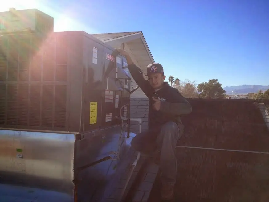 HVAC technician performing HVAC Inspection on a rooftop unit in Middle Paxton